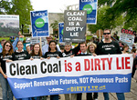 Citizens protest Duke Energy with a "Clean Coal is a Dirty Lie" banner.