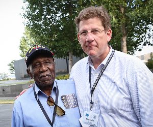 Mike Couick, right, pauses with a WWII veteran during an event sponsored by the electric cooperatives. Photo by Luis Gomez