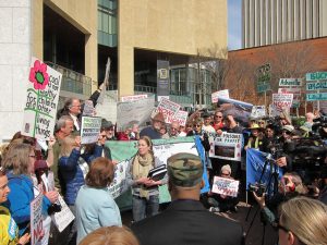 Protesters gather outside Duke Energy headquarters in Charlotte, N.C. A new poll reveals overwhelming support for swift action by North Carolina lawmakers and regulators to prevent future coal ash spills.