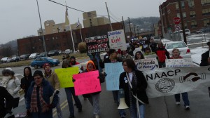 On Feb. 8, citizens and community organizations marched to West Virginia American Water to demand compensation for the expenses they incurred as a result of the chemical spill. They say the private utility contributed to the problem. Among other things, the water company billed customers based on estimated historical usage in January even though many were unable to use their water during this time. Photo by Vivian Stockman