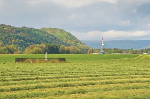 A natural gas drilling rig in Loyalsock Creek Valley, Pa., sits near a family cemetery and Baptist church. Photo courtesy of Terry Wild Stock Photography.
