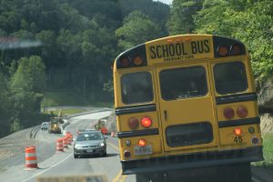 Buses transporting students to and from Ridgeview High School on Route 83 must contend with a steep descent and frequently clogged roadway. Photo by Molly Moore
