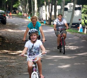 A family bikes at Grayson Highlands State Park campground, near the popular 34-mile Virginia Creeper Trail. Photo courtesy Virginia State Parks
