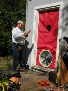 Energy auditor evaluates a home. Image courtesy of City of Knoxville Office of Sustainability and Knoxville-Knox County Community Action Committee Housing & Energy