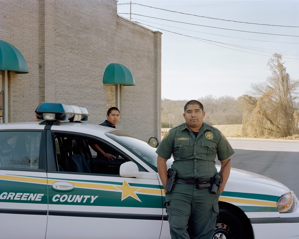 Greene County, Tenn., police officers, part of “Hispanic Appalachia” by Megan King