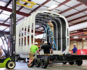 Workers assemble the building with components printed on-site. Photos courtesy of ORNL