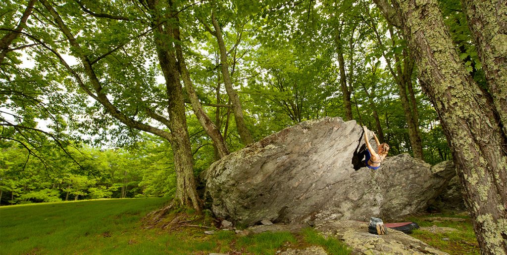 Julia Statler completes a challenging climb called “Wall Street” in the Picnic Area of Grayson Highlands. Photo by Dan Brayack