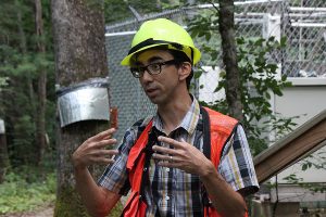 Chris Oishi discusses his research in “The Electric Forest" at the Coweeta Hydrologic Laboratory. Photo by Karl Bates