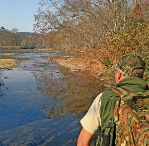 Lamar Marshall stands near the mouth of Brush Creek as he looks out over the Little Tennessee River. Photo by Kevin Ridder. 