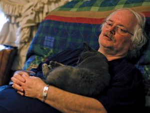 When Ronald Wilmoth had his heat exhaustion episode, his cat wouldn’t leave his side until the ambulance arrived.  Photo by Lou Murrey
