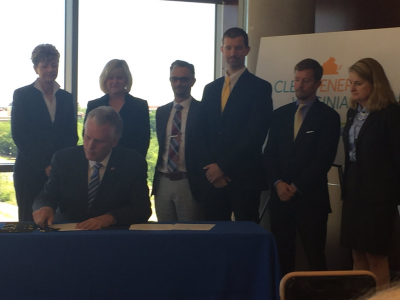 Gov. McAuliffe signs Executive Directive 11 with clean energy advocates. Photo by Mary Rafferty.