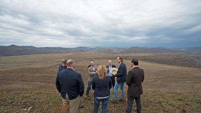 Jonathan Webb talks to group at site of former mine