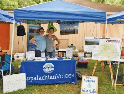 This summer, Max Rooke, left, and Lara Mack of our Virginia team shared news and resources about the fight against proposed pipelines at events across the state.