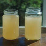 Mason jars with yellow tap water