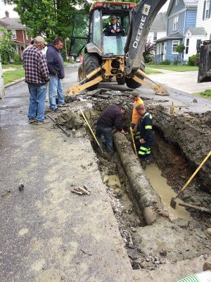 crew works on water line