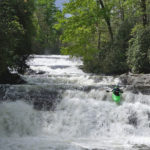 kayak runs waterfall