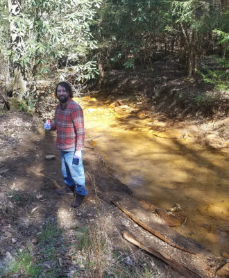 Matt with water sample near Copperas Fork
