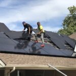 people installing solar