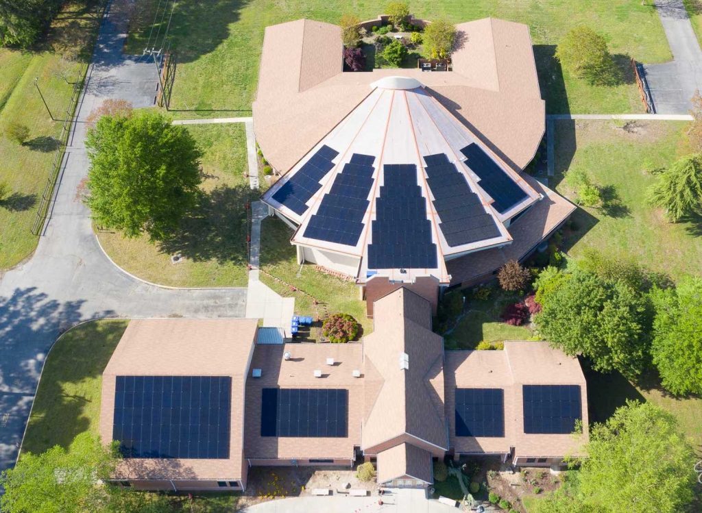 aerial view of a church with solar panels