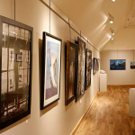 view of gallery with art on the wass