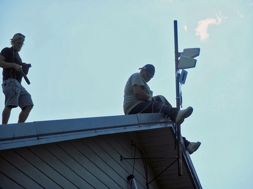 people installing antenna