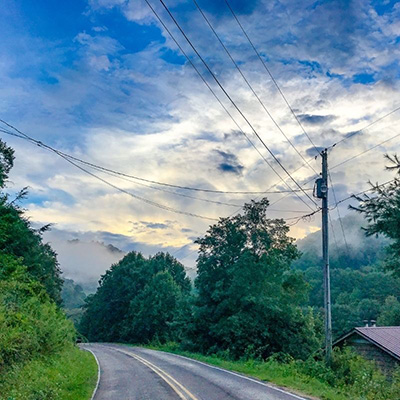 Power lines crossing a country road in Appalachia