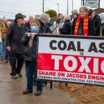 Rally outside of Jacobs Engineering in Knoxville in December 2019. To the left of the photo in the brown hat is the late John Stewart, a former TVA employee and unyielding advocate for the Kingston workers. Photo by Todd Waterman
