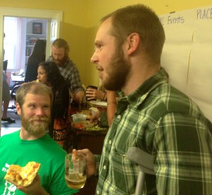 Kent Walker (left), a home energy contractor, and John Kidda, a builder, discuss all things energy efficiency over pizza and beer.