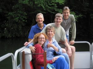 Martha Paradeis, center, with husband John Dozier, left, sons Carey and Julian, and Julian's wife Casey during a 4th of July boat ride at Lake Glenville, N.C. 