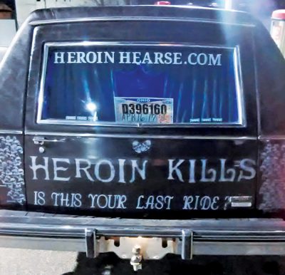 Heroin Hearse, a nonprofit community action group in Huntington, W.Va., drives this hearse to spread awareness of the opioid epidemic. One of their recent initiatives was to clean out a walking tunnel littered with used needles. Photo courtesy of Dwayne Woods/Heroin Hearse