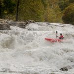 Kayaker in the rapids.