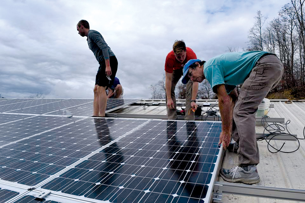 people installing solar panels