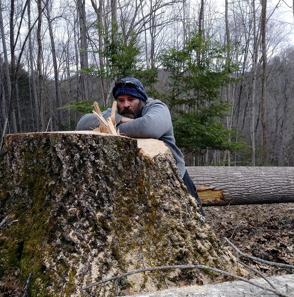 man by tree