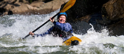 Chrissy paddles through whitewater