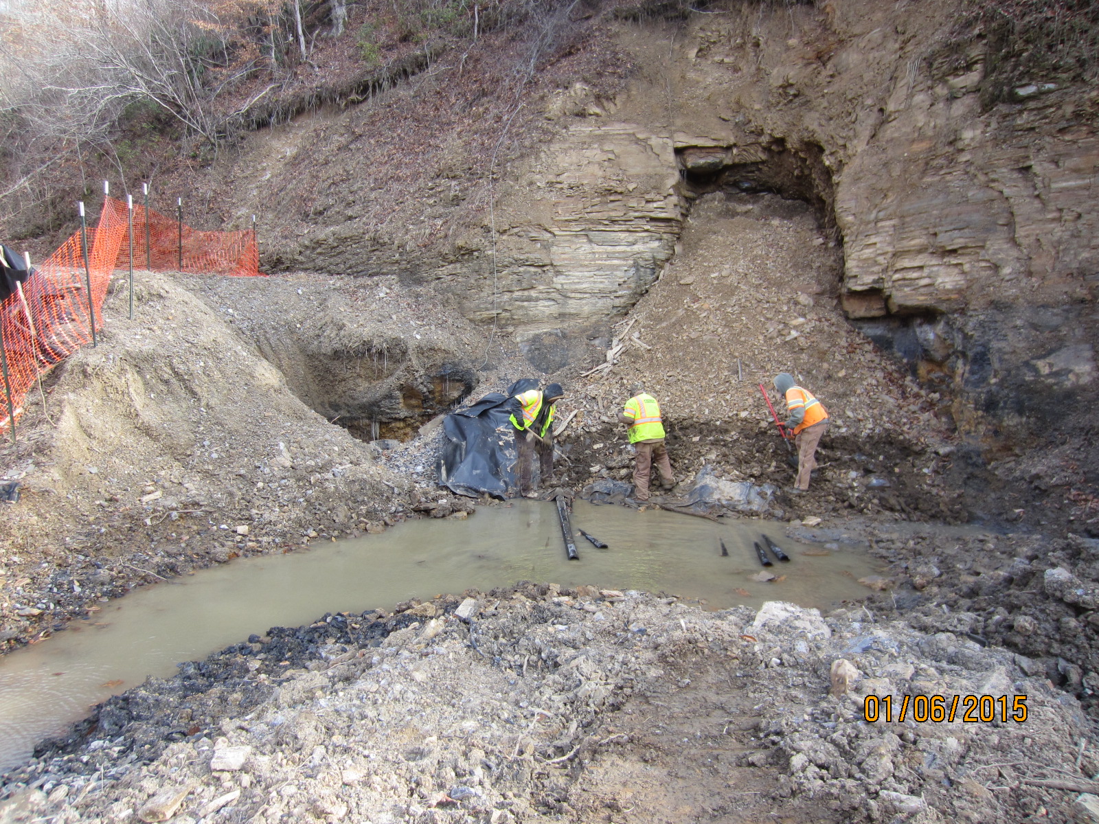 workers cleaning up mine site