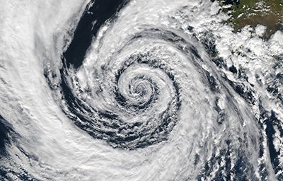 A hurricane eye from space. One of the direct results of climate change is an increase of severe storms.