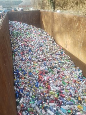 a large bin with hundreds of empty aluminum cans