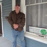 Man stands on the porch of Appalachian Citizens' Law Center