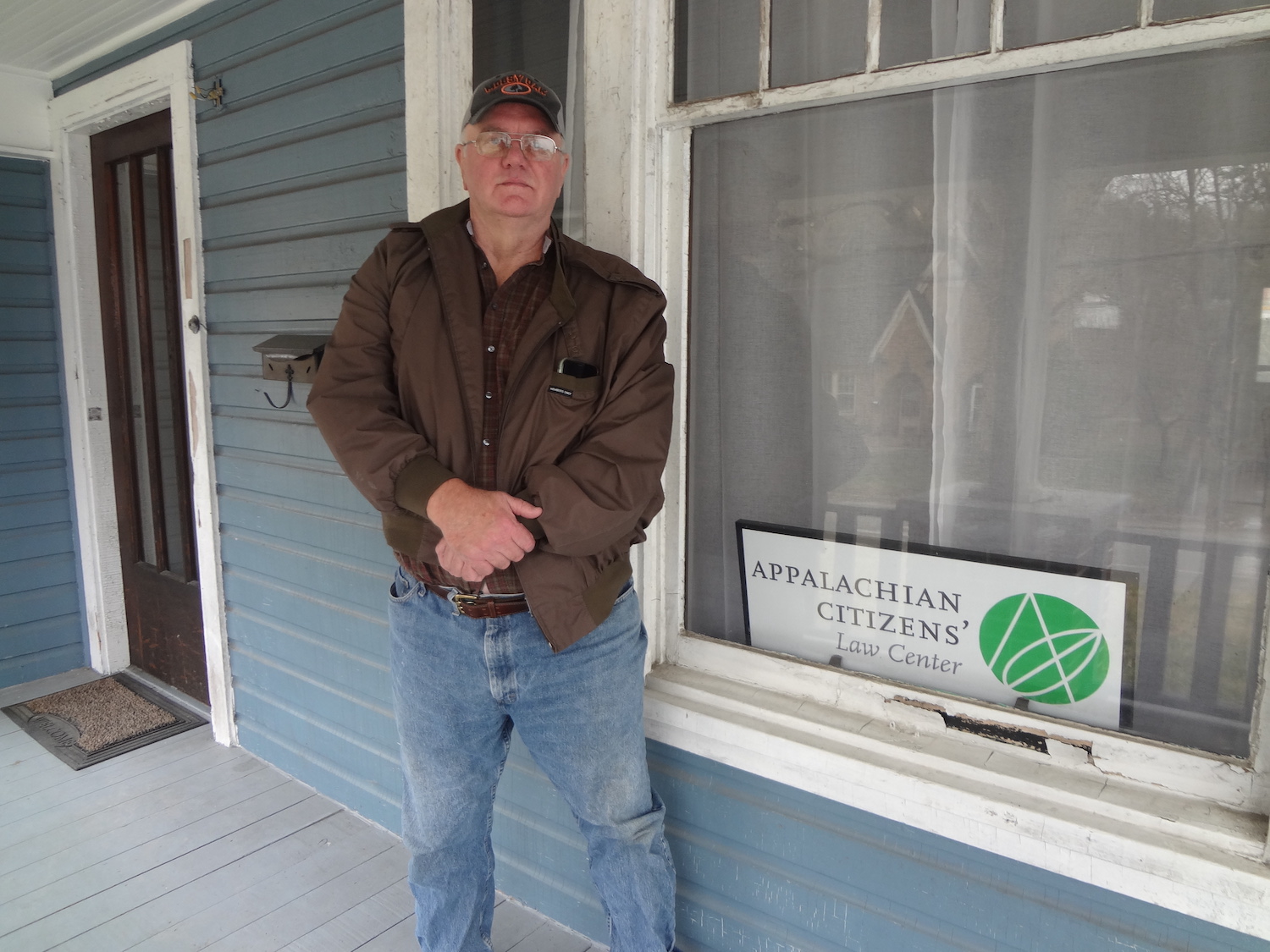 Man stands on the porch of Appalachian Citizens' Law Center