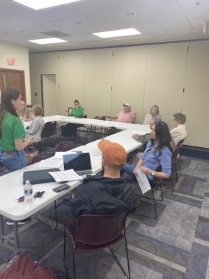 Flood-impacted Buchanan County residents speak with UNITY group organizers about their experiences with flood relief after the 2021 and 2022 disasters. Photo taken April 27, 2023, at the Buchanan County Public Library by Rance Garrison