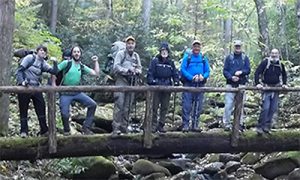 Freelance writer Davis Wax, second from left, pauses with the Rocky Top Trail Crew on the Snake Den Ridge Trail. Photo by Kayah Gaydish
