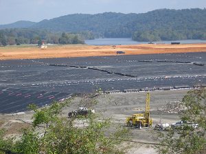 The black liner covering the coal ash containment cell, above, will be topped with two feet of soil and grass when the Tennessee site is converted to a park. Photo by Cat McCue. 