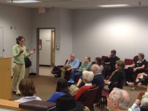 Customers of Appalachian Power gather in Lynchburg to learn about their utility's resistance to expanding energy efficiency and investing in solar. 