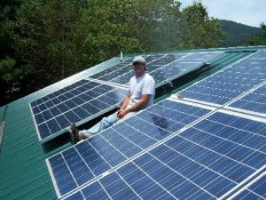 John Parker, an electrician who founded Parker Electric, donated his time to install solar panels on both Ashe County Habitat for Humanity's houses.