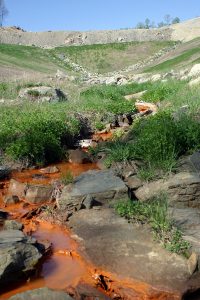 Polluted water runs off a surface mine valley fill in eastern Kentucky. Photo by Matt Wasson 