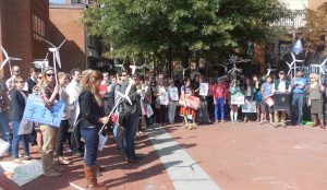 Concerned citizens and clean energy advocates gather on the downtown mall in Charlottesville for a National Day of Climate Action.