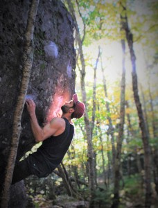 Aaron Parlier is focused on the “Eye of the Narwal,” one of many climbs along the Listening Rock Trail at Grayson Highlands. Photo by Sarene Cullen
