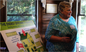  Mary Ruble speaks at an Appalachian Voices event to present more than 1,000 signatures from Blue Ridge Electric members supporting access to "on-bill" financing