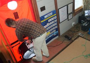  John Kidda, owner of reNew Home Inc , performs an energy audit as part of Appalachian Voices’ home energy makeover contest in 2015.