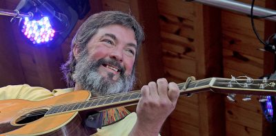 Larry Keel plays the guitar